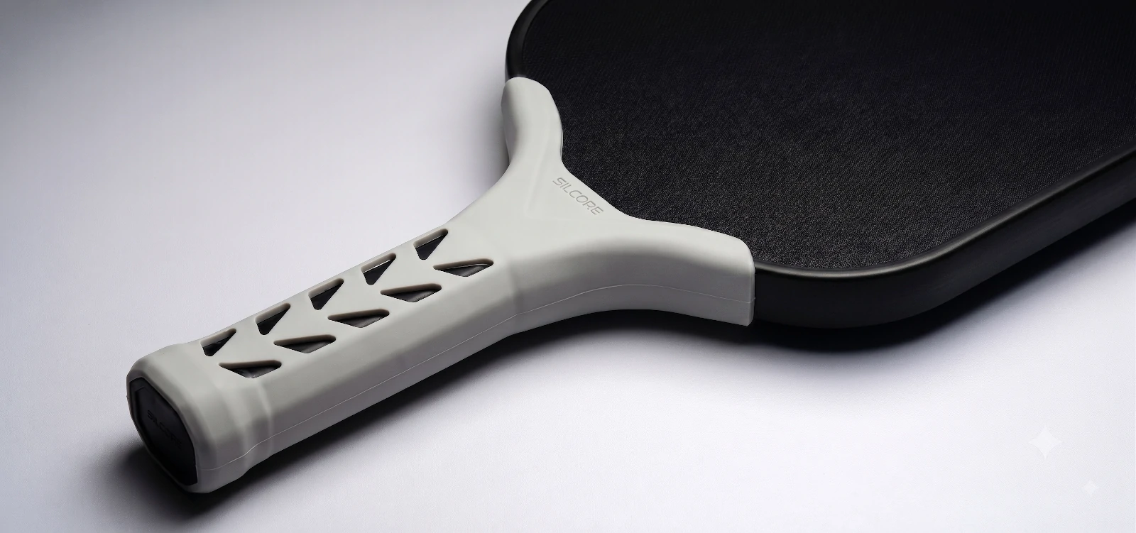 White Silcore undergrip on a black pickleball paddle