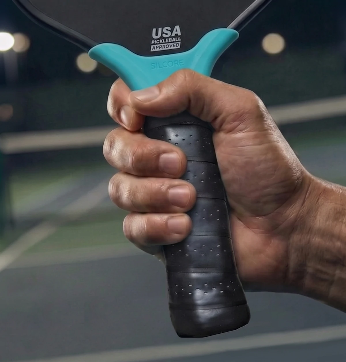 Silcore undergrip under the grip tape, in a player's hand
