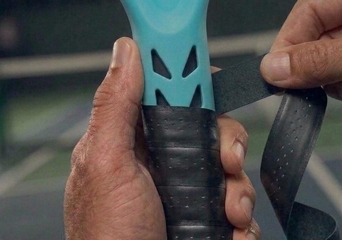 Grip tape being wrapped over the Silcore undergrip