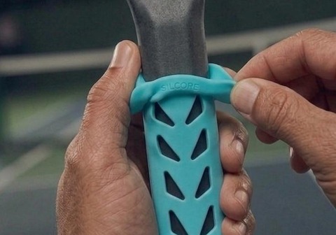 Silcore undergrip being pushed onto a bare paddle handle by hand